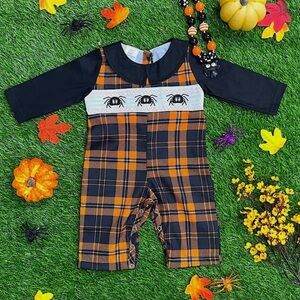 Orange Black and white plaid smocked romper with embroidered spiders NWOT